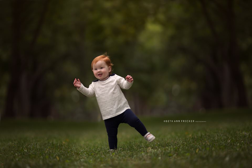 toddler walking in the commonwealth mall boston baby photographer