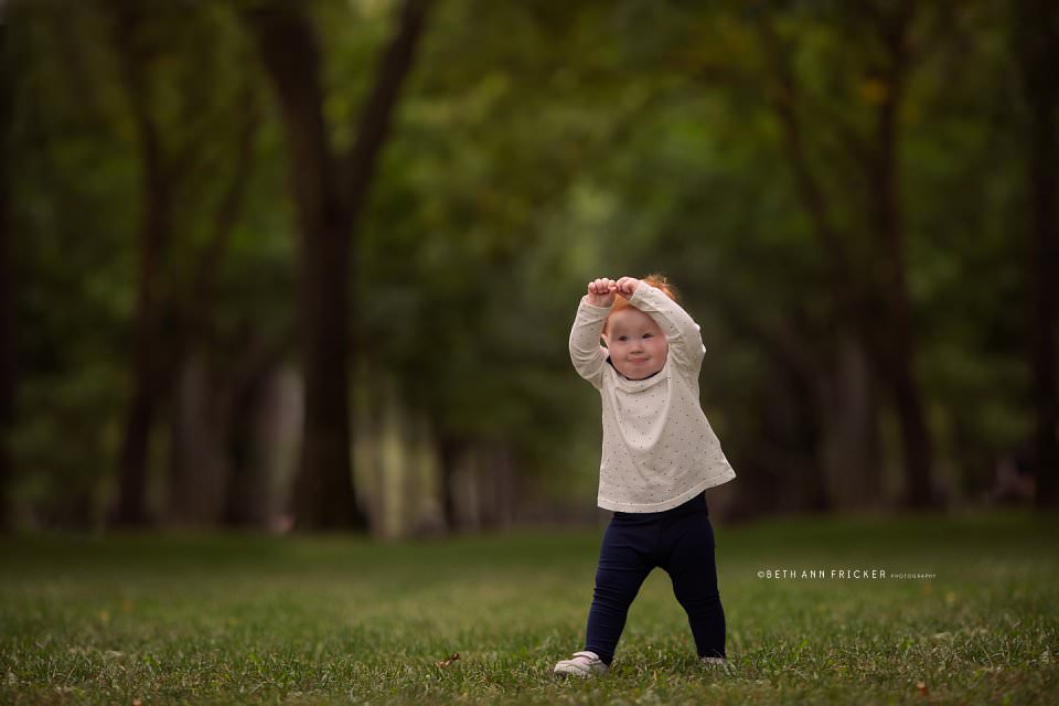 toddler being an elephant in the commonwealth mall boston baby photographerboston baby photographer