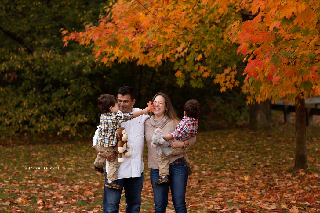 family playing with leaves belmont ma family photographer