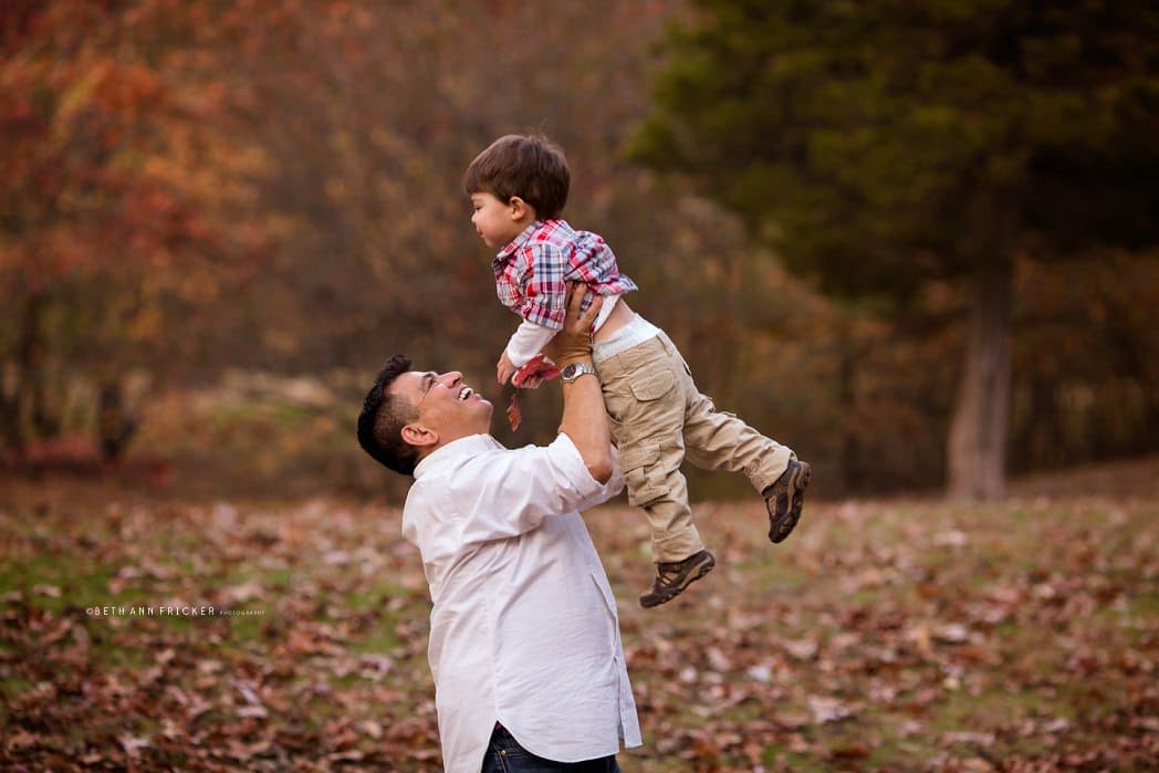 dad lifting toddler boy belmont ma family photographer