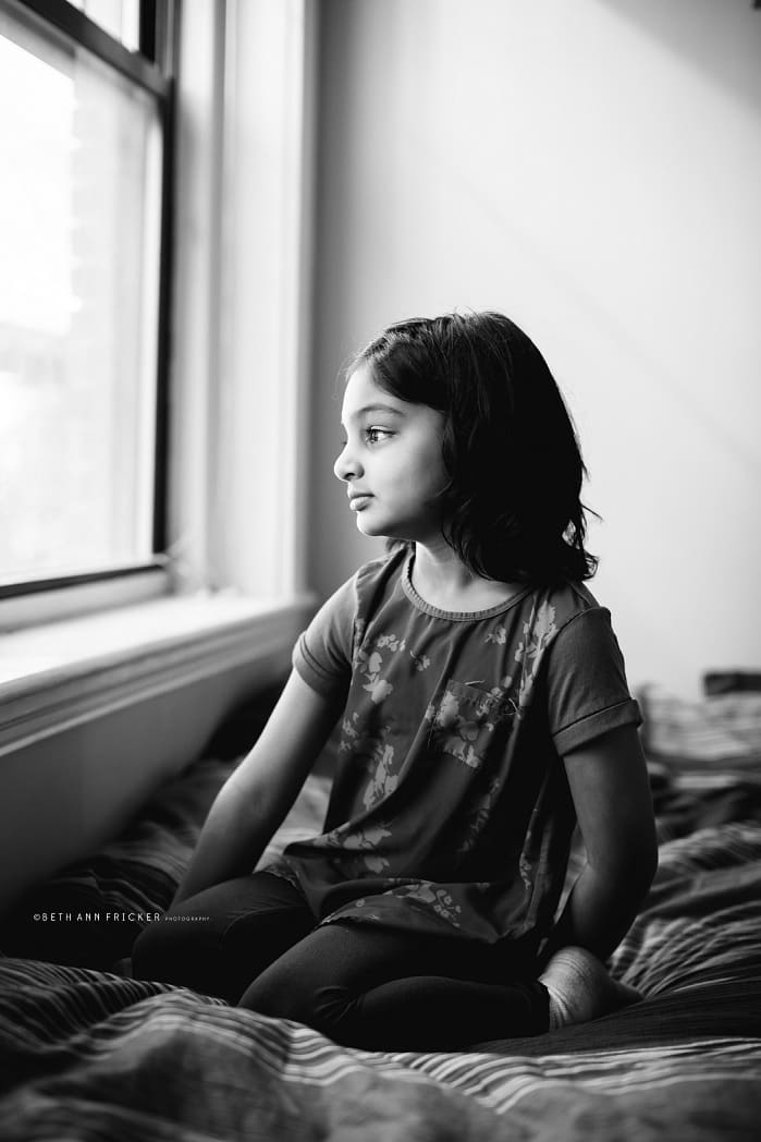 gazing out of a window Brookline MA family photographer