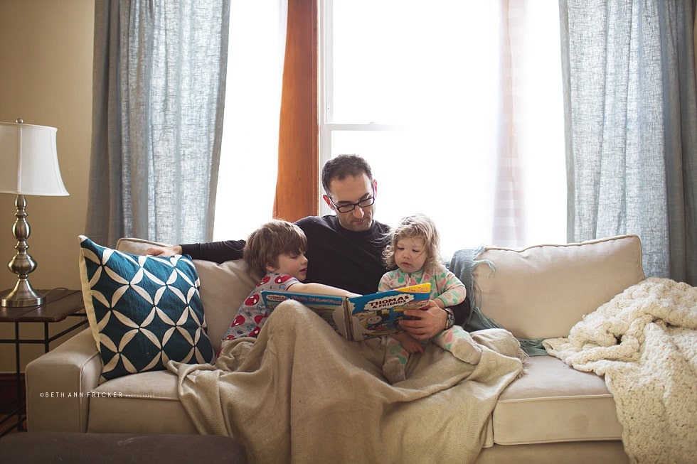 toddlers reading with daddy on Saturday morning