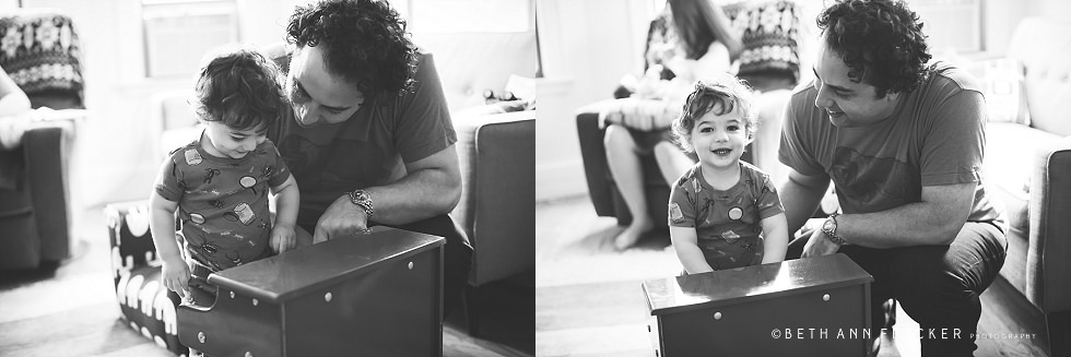 Toddler playing piano with dad Boston newborn lifestyle photographer