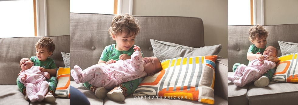 Boston newborn lifestyle photographer dad with big brother holding baby sister