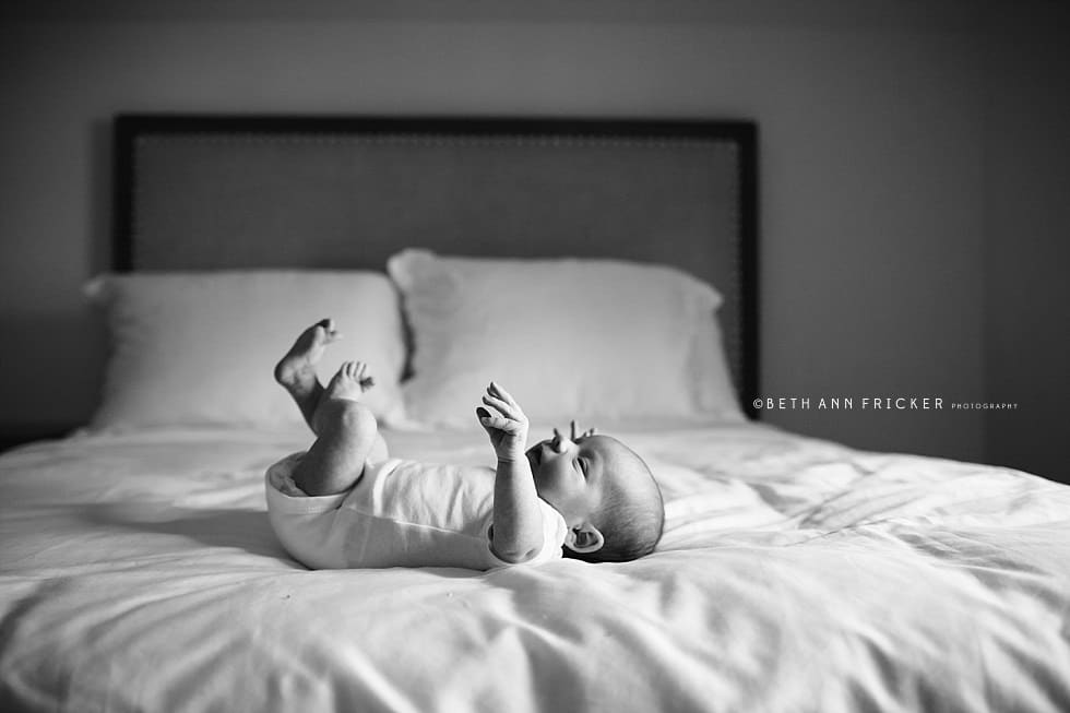 newborn baby on bed Wellesley Newborn photographer