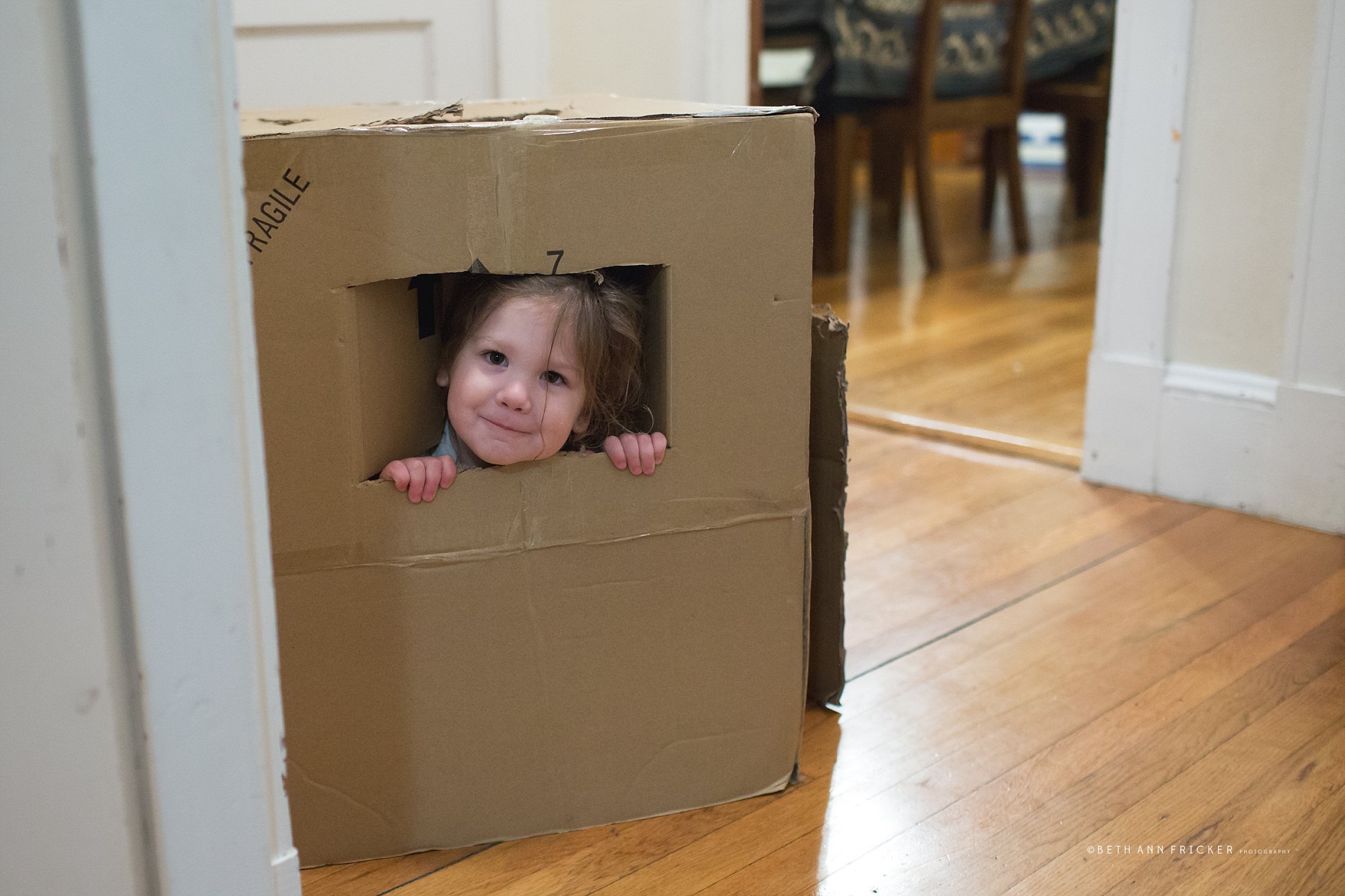 child peeking out of box boston child photographer