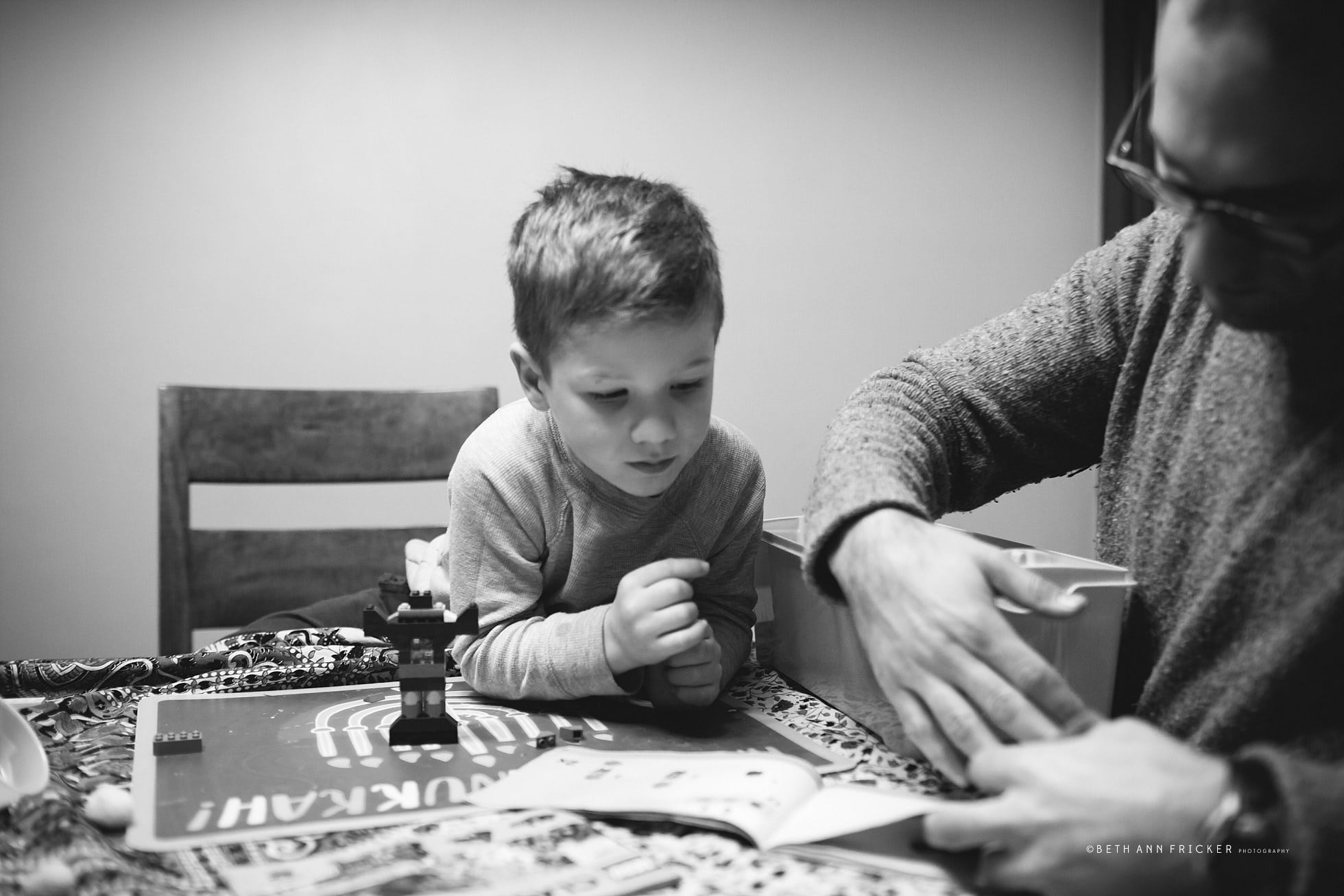 boy working on legos with dad boston child photographer