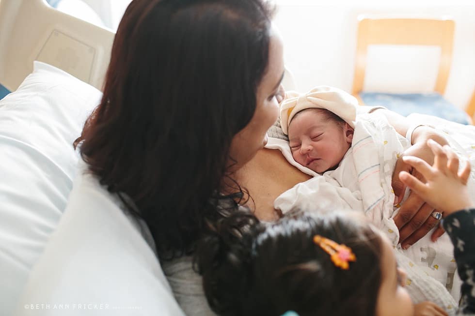 newborn baby with mom and big sister Boston newborn Photographer hospital session