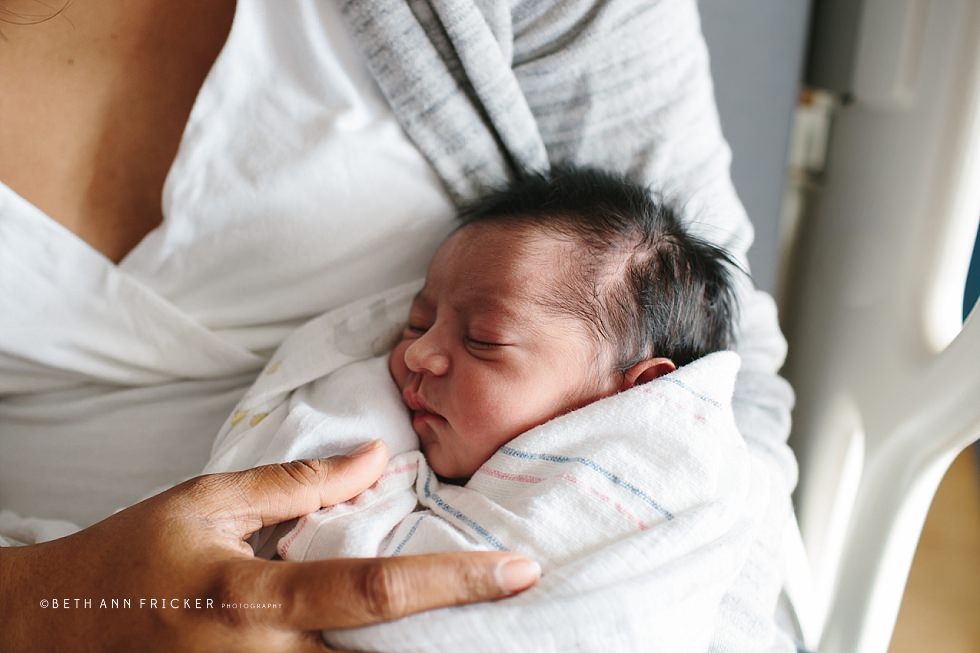 newborn baby in mom's arms Boston newborn Photographer hospital session
