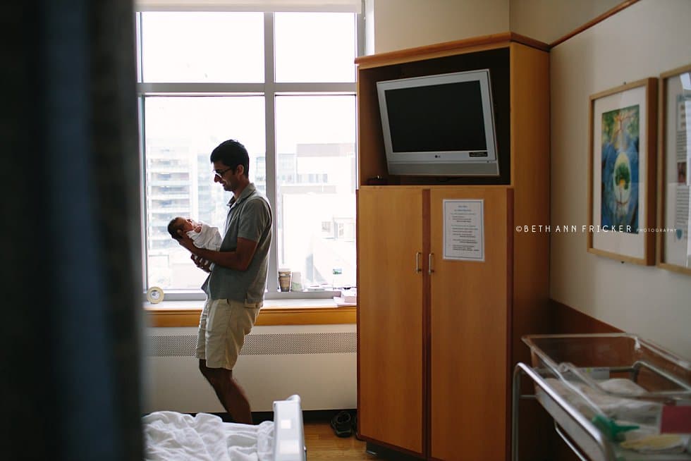 dad with newborn daughter in hospital cambridge ma newborn photograher