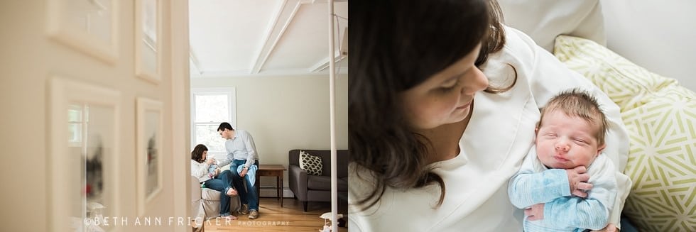baby in mom and dad's arms sitting on couch boston newborn photographer