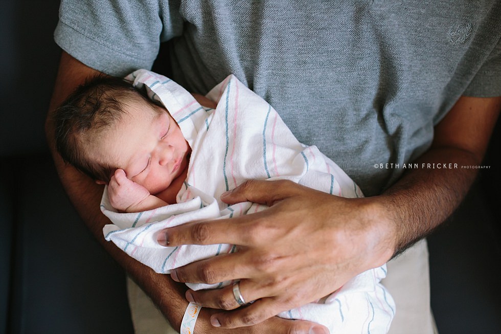 Dad holding newborn baby in the hospital Boston newborn photographer