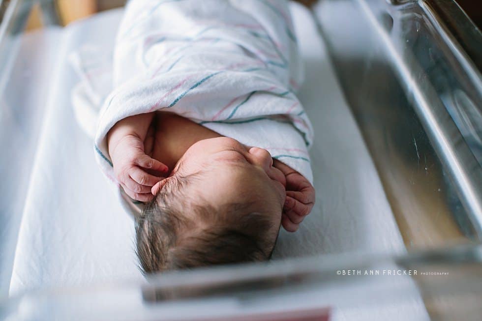newborn baby wrapped up in a swaddle in the hospital Boston newborn photographer