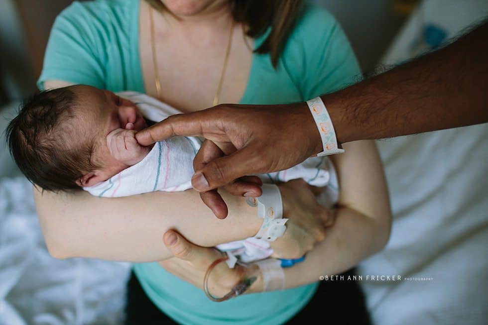 newborn baby holding dads finger in the hospital Boston newborn photographer