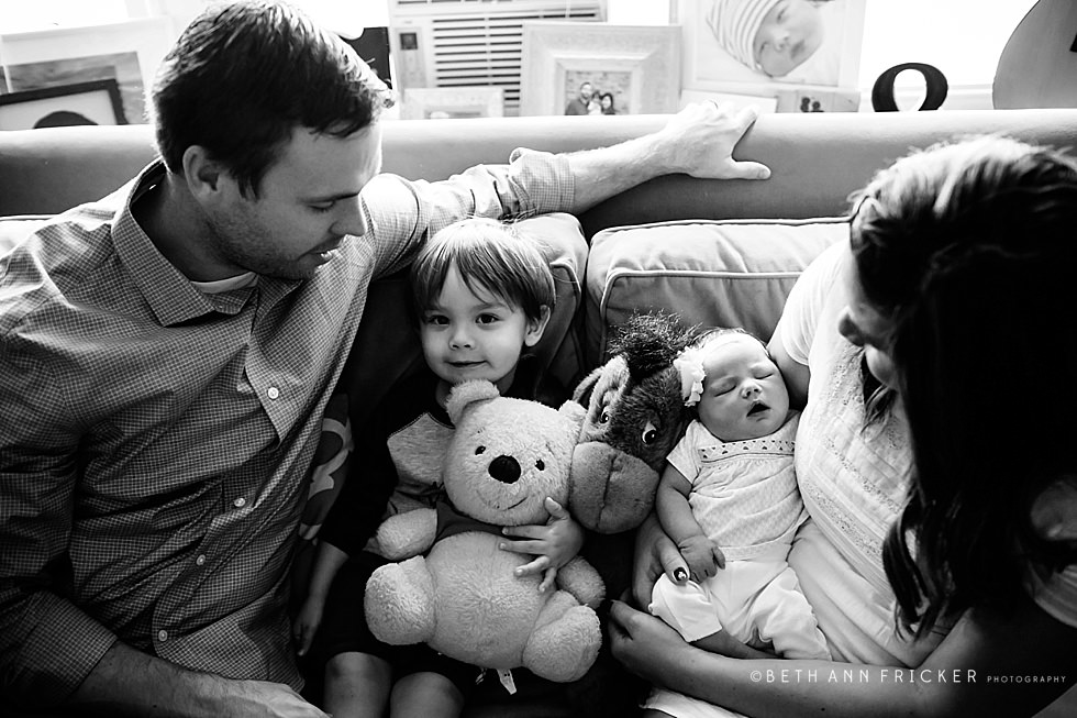family of four with toys Arlington MA Newborn Photographer