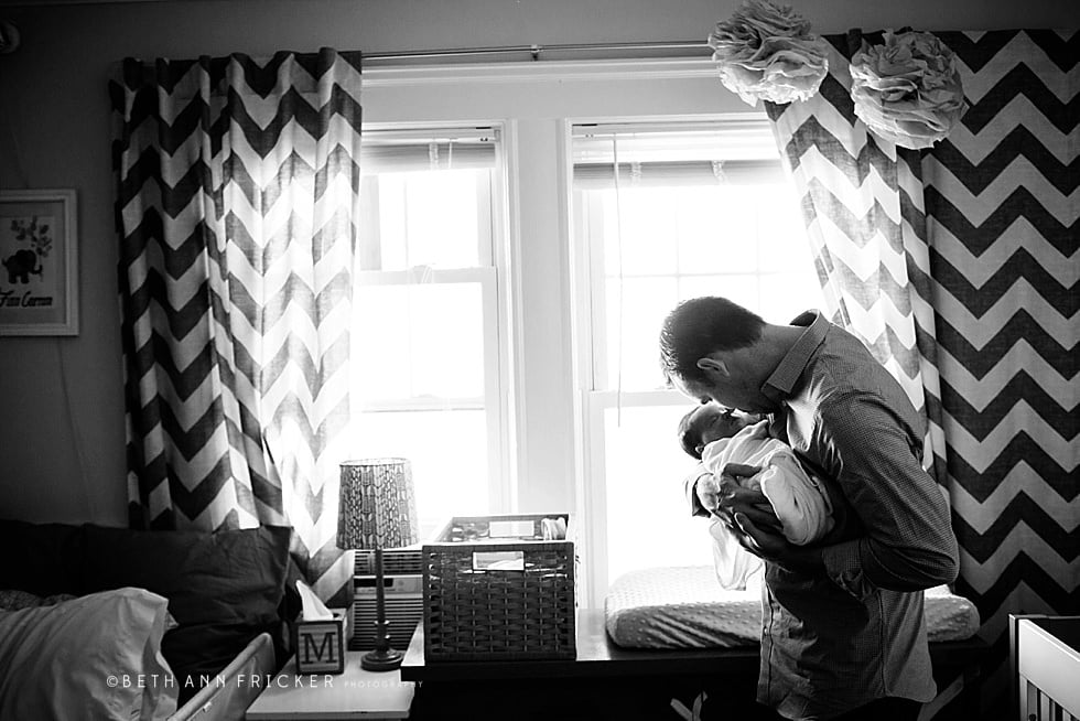 dad snuggling newborn daughter Arlington MA Newborn Photographer