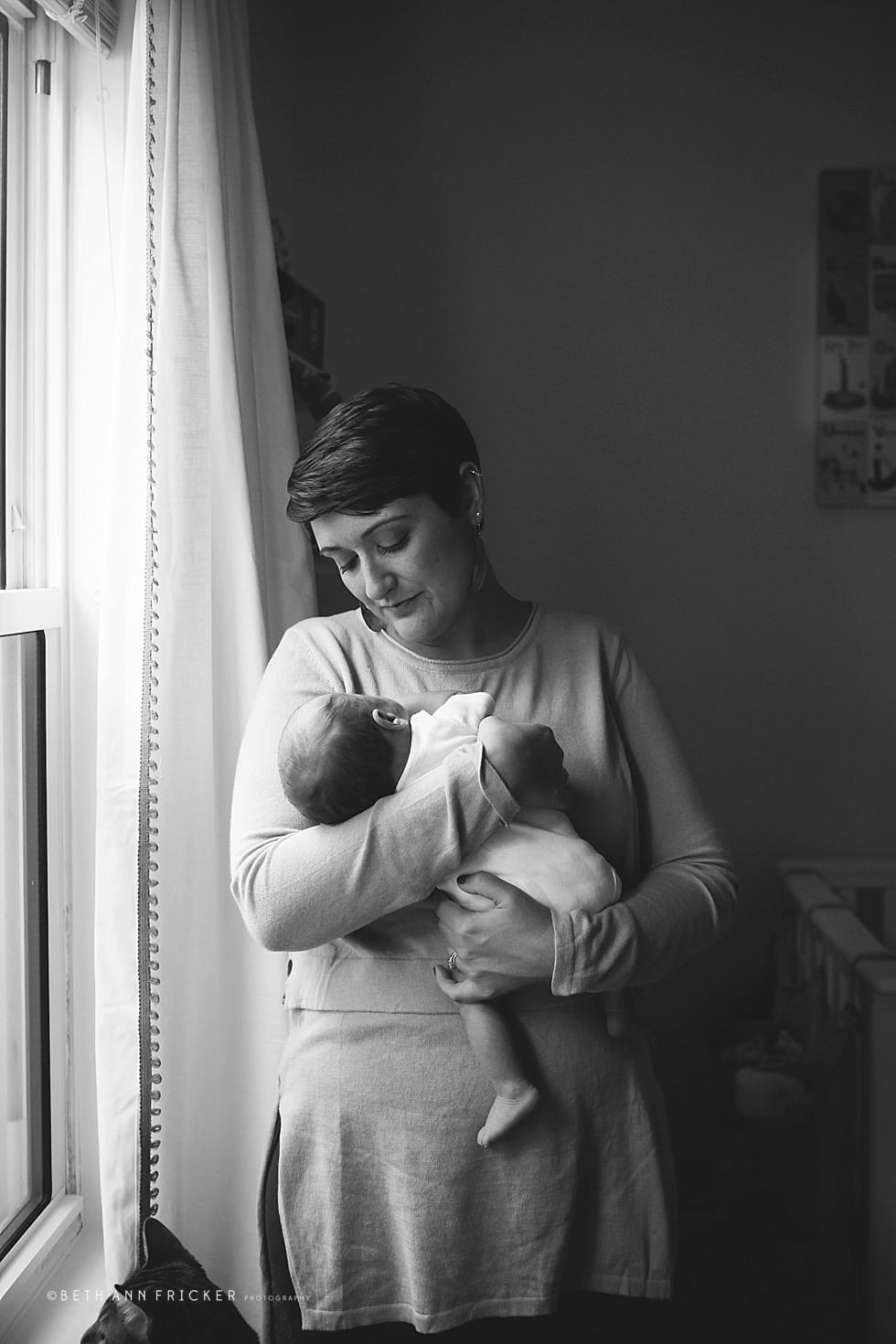 mom holding newborn son Watertown Newborn Photographer
