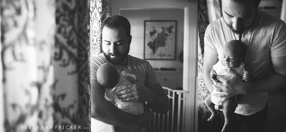 dad holding newborn son Watertown Newborn Photographer