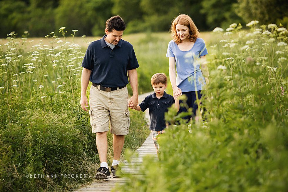family of three walking together Boston Family Photographer