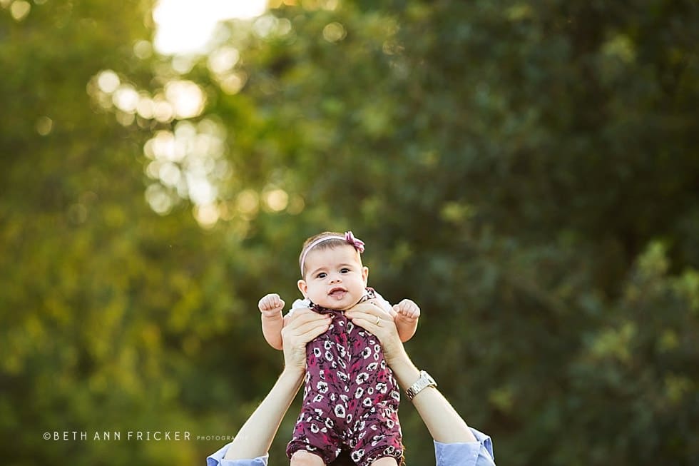 dad holding his daughter Somerville family Photographer