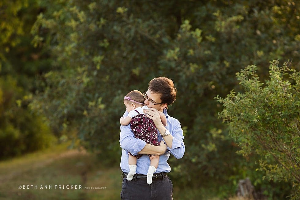 dad cuddling his daughter Somerville family Photographer