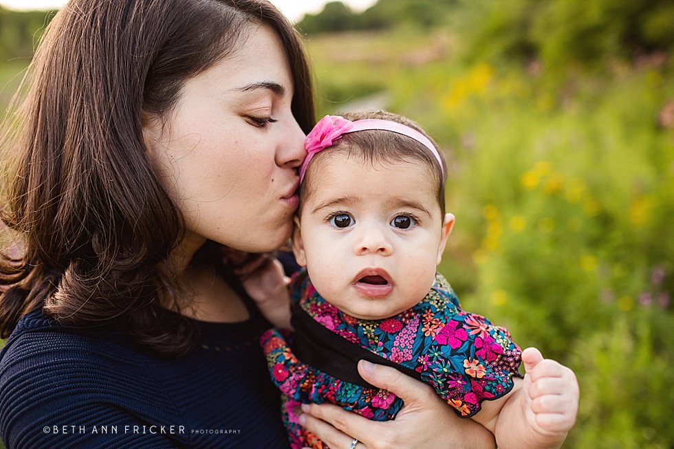 mom kissing her daughter Somerville family Photographer