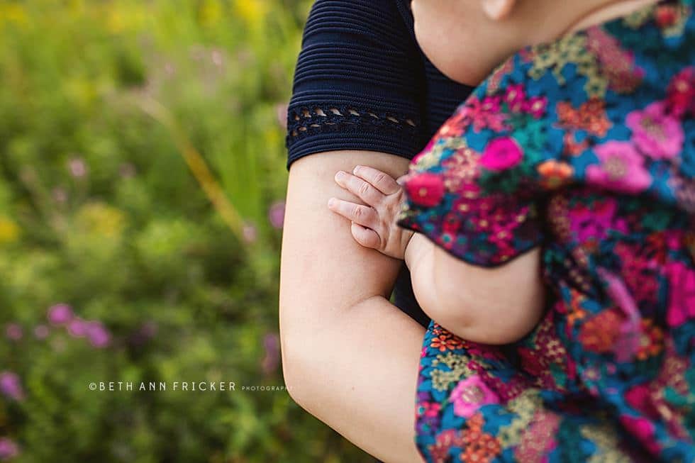 baby holding her mom's arm Somerville family Photographer