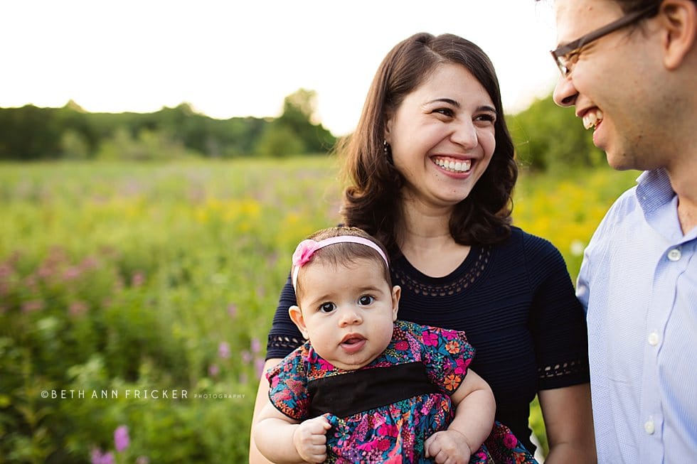 family with baby walking on a boardwalk Somerville family Photographer