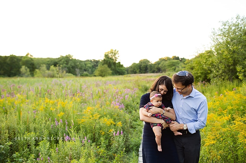 family with baby walking on a boardwalk Somerville family Photographer