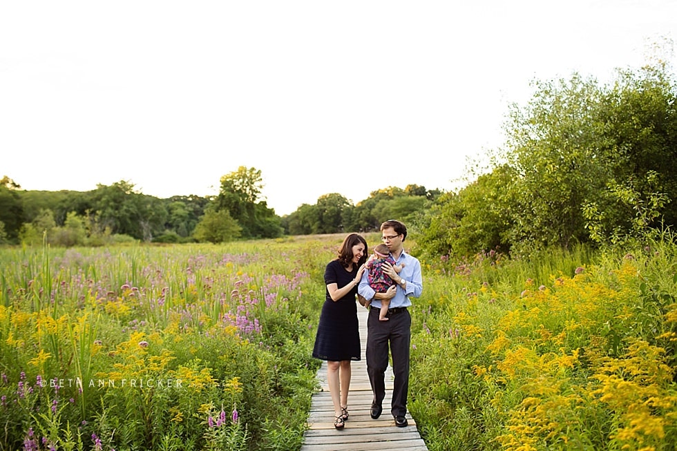 family with baby walking on a boardwalk Somerville family Photographer