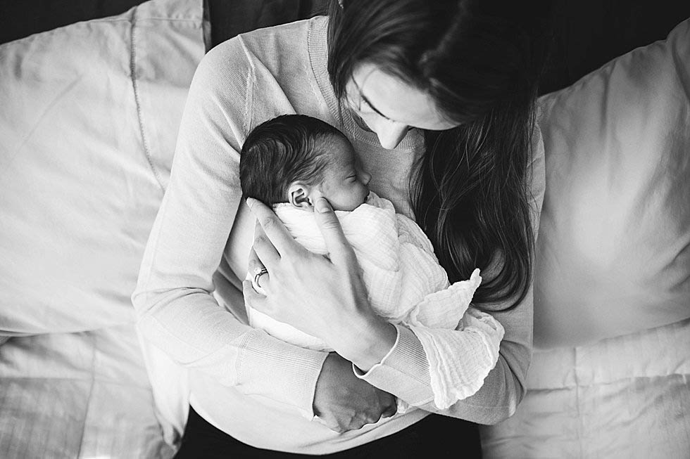 mom cradling newborn baby girl Concord Newborn PHotographer