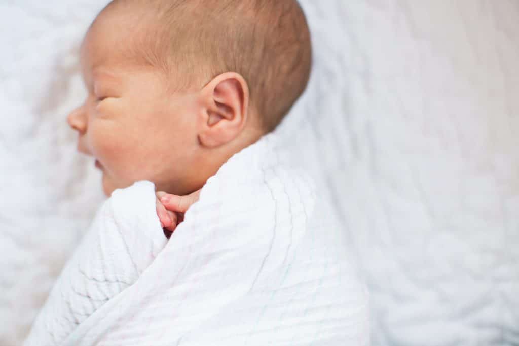 Newborn baby girl wrapped up Boston Newborn Photographer