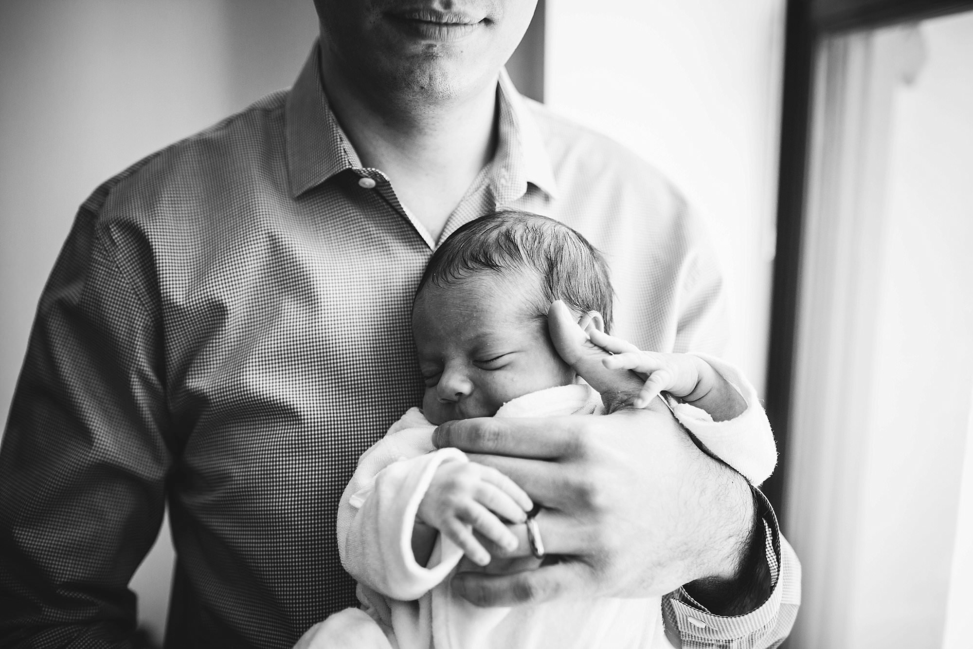dad holding newborn baby boston newborn photographer