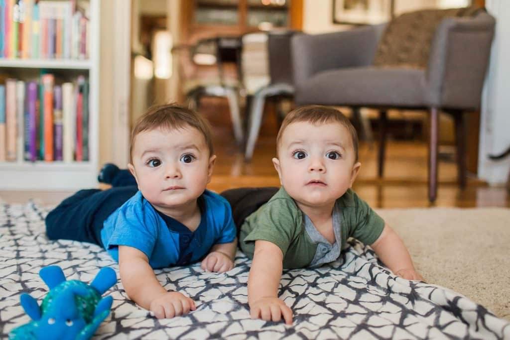 tummy time with twins on the floor Boston baby photographer