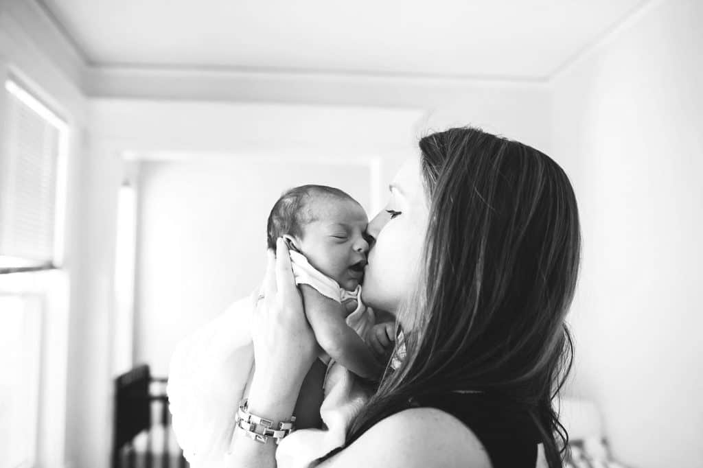 mom kissing newborn baby girl newton newborn photos
