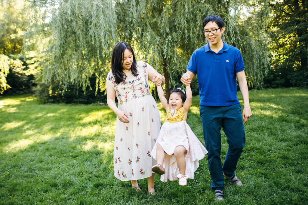 Boston Maternity Photographer parents swinging daughter