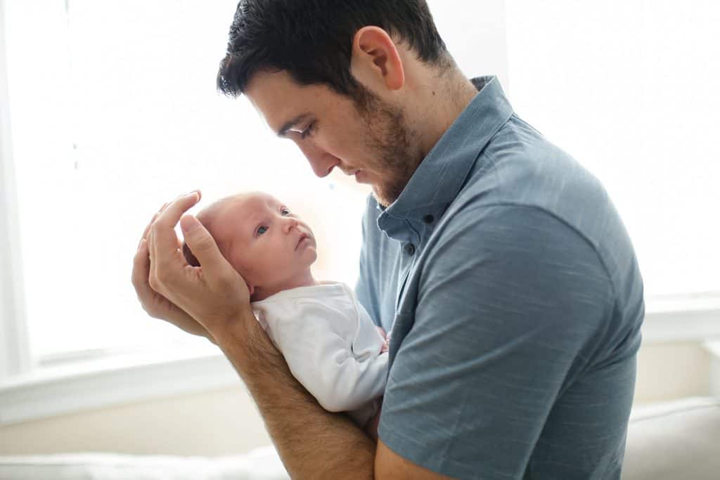 dad looking at baby boston newborn lifestyle photography