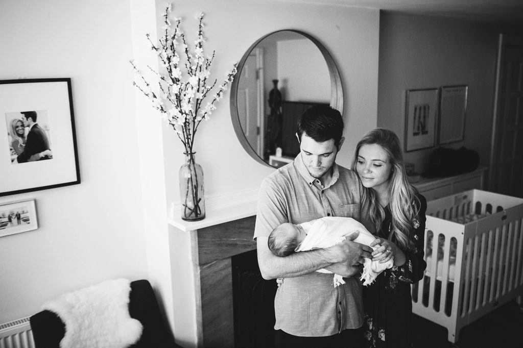 parents holding newborn baby boston newborn lifestyle photography