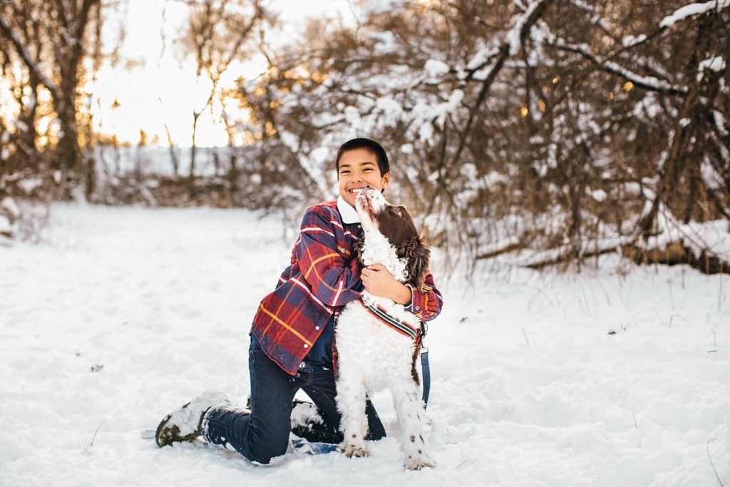 portraits of a boy and his dog in the snow Massachusetts Family photographer