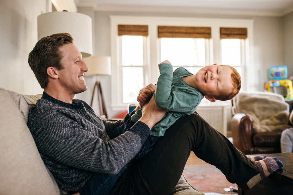 dad tickling son Medford Newborn photographer