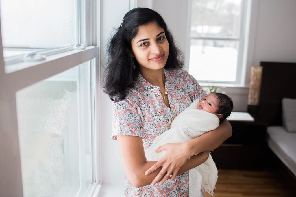 mom holding baby Bedford Newborn Photographer