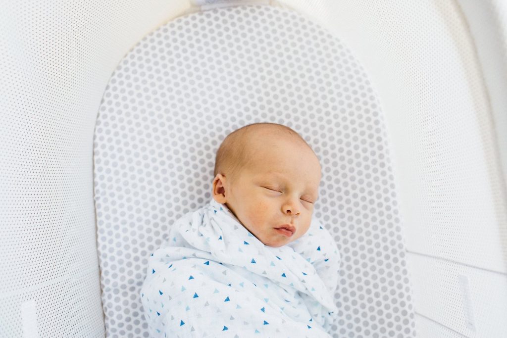baby in a bassinet Hingham newborn photographer