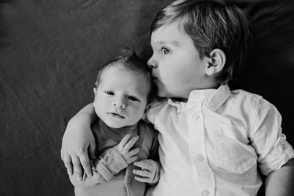 big brother holding baby brother Medford newborn photographer