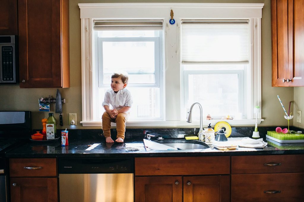 big brother sitting on counter Medford newborn photography