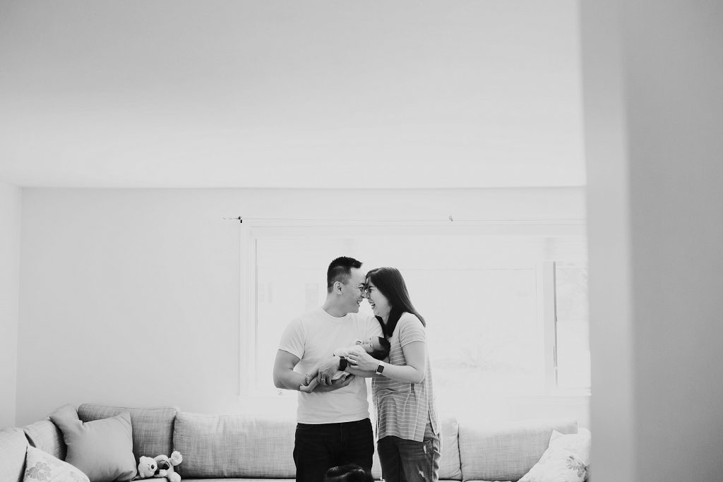 mom and dad holding baby Acton Newborn Photographer