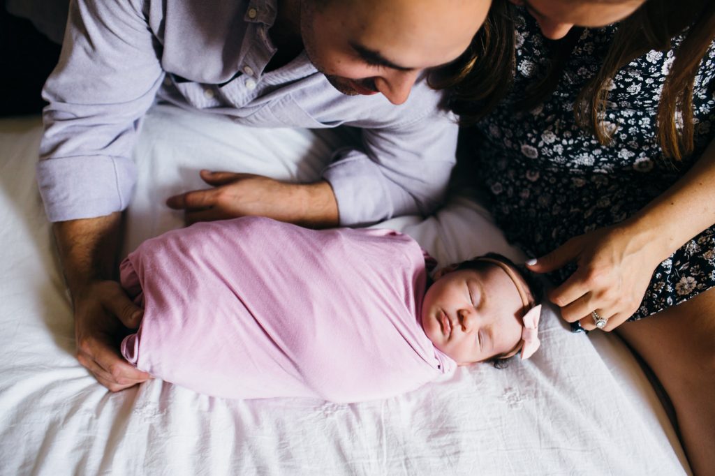 parents touching baby's head Boston Newborn Photography