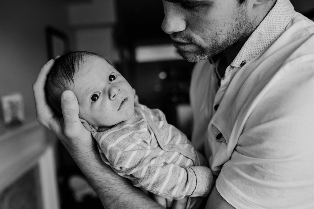 Dad snuggling with baby Charlestown Newborn Photographer