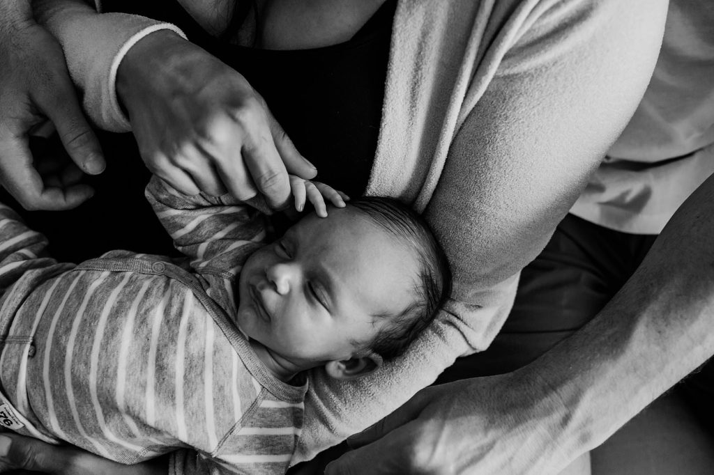 baby in parents' arms Charlestown Newborn Photographer