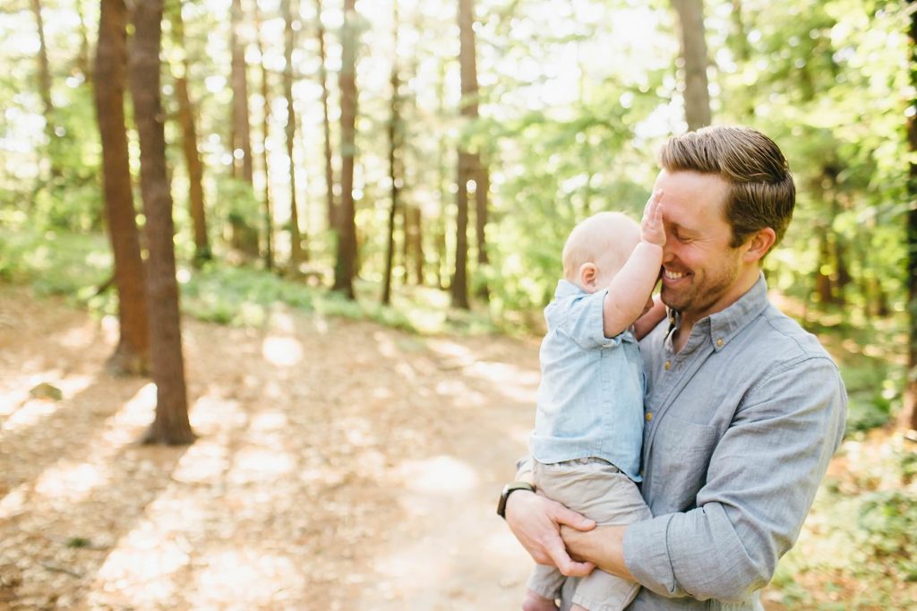 dad laughing at baby son Medford Family Photographer