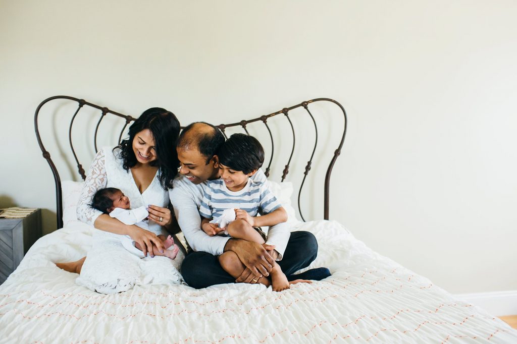 family snuggling together MA Newborn Photographer